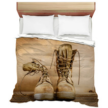 Old Brown Military Boots On A Wooden Table Bedding 127621049