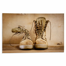 Old Brown Military Boots On A Wooden Table Rugs 127621049