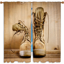 Old Brown Military Boots On A Wooden Table Window Curtains 127621049