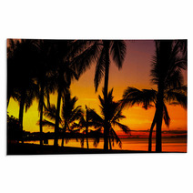 Palms Silhouettes On A Tropical Beach At Sunset Rugs 53244152