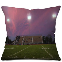 Pans Of A High School Football Stadium In Front Of A Beautiful Pink And Purple Sky Pillows 137099092
