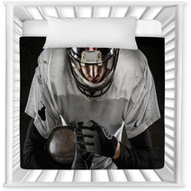 Portrait Of American Football Player Holding A Ball And Looking Nursery Decor 59517619