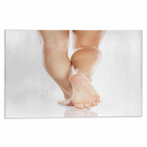 Pretty Female Legs And Bare Feet On White Background Rugs 66194693
