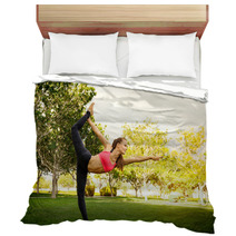 Pretty Woman Doing Yoga Exercises In The Park Bedding 115027038