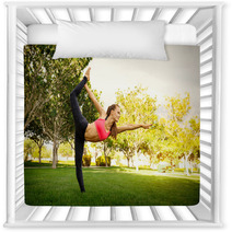 Pretty Woman Doing Yoga Exercises In The Park Nursery Decor 115027038