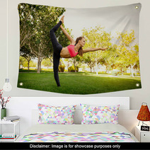 Pretty Woman Doing Yoga Exercises In The Park Wall Art 115027038