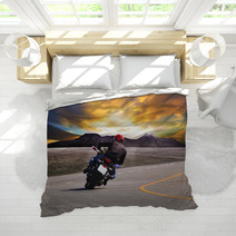 Rear View Of Young Man Riding Motorcycle In Asphalt Road Curve W Bedding 65917944