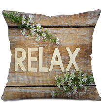 Relax Written On Rustic Wood And Chamomile Flowers
 Pillows 91278913