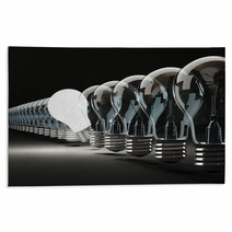 Row Of Light Bulbs On Black Background Rugs 46830627