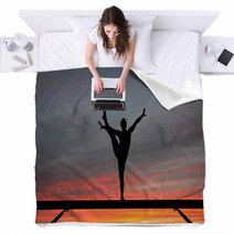 Silhouette Of Female Gymnast On Balance Beam In Sunset Blankets 42661355