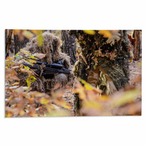 Sniper Hiding In The Bushes/Sniper In Camouflage Suit Hiding Among The Bushes In The Autumn Forest Rugs 93951075