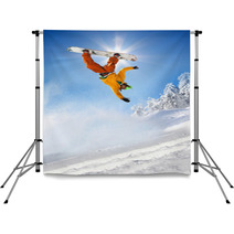 Snowboarder Jumping Against Blue Sky Backdrops 34344721