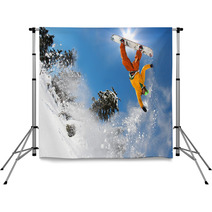 Snowboarder Jumping Against Blue Sky Backdrops 36077637