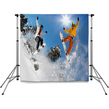 Snowboarders Jumping Against Blue Sky Backdrops 37675042
