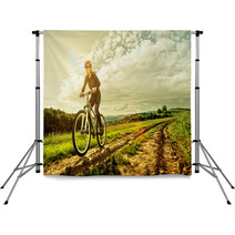 Sport Bike Woman On A Meadow With A Beautiful Landscape Backdrops 64906341
