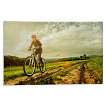Sport Bike Woman On A Meadow With A Beautiful Landscape Rugs 64906341