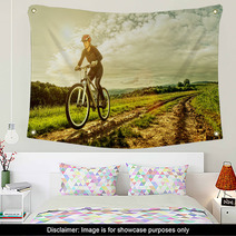 Sport Bike Woman On A Meadow With A Beautiful Landscape Wall Art 64906341
