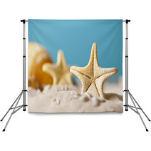 Starfish On Sand And Blue Background Backdrops 64985103