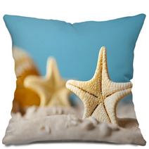 Starfish On Sand And Blue Background Pillows 64985103