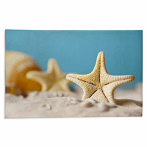 Starfish On Sand And Blue Background Rugs 64985103