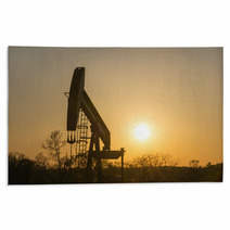 Texas Oil Well Against Setting Sun Rugs 61657158