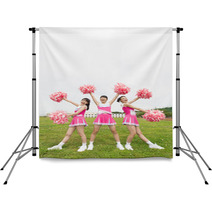 Three Cheerleaders Cheering With Pom Pom Backdrops 171422673