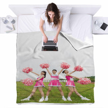 Three Cheerleaders Cheering With Pom Pom Blankets 171422673