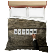 Top View Of Male Hand Assembling The Word Action Bedding 94991747