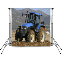 Tractor Plowing The Field On Mountains Backdrops 51509437