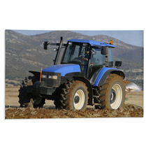 Tractor Plowing The Field On Mountains Rugs 51509437