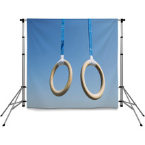 Traditional Wooden Gymnast Rings Hanging From Blue Straps In Clear Blue Sky Backdrops 93445411