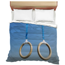 Traditional Wooden Gymnast Rings Hanging From Blue Straps In Clear Blue Sky Bedding 93445411