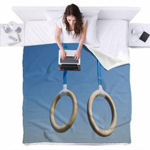 Traditional Wooden Gymnast Rings Hanging From Blue Straps In Clear Blue Sky Blankets 93445411