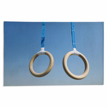 Traditional Wooden Gymnast Rings Hanging From Blue Straps In Clear Blue Sky Rugs 93445411