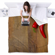 Two Red Hot Chili Peppers On A Wooden Background Blankets 66710225
