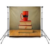 Vintage Books And Cup With Mustache On Wooden Table Backdrops 53458311