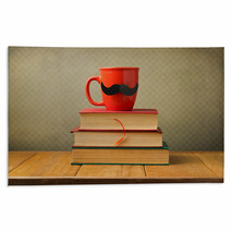 Vintage Books And Cup With Mustache On Wooden Table Rugs 53458311