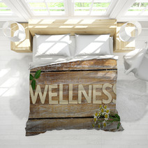 Wellness Written With Wooden Letters, Chamomile Flowers On Wood Bedding 72887337