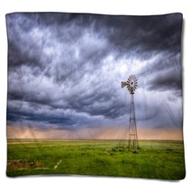 Windmill On A Farm In An Open Field Under A Dramatic Sky Blankets 205765028
