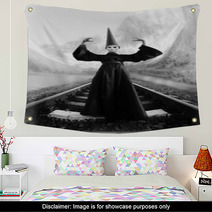 Wizard In Black Cloak And Dunce Hat Standing On Rails Wall Art 66610186