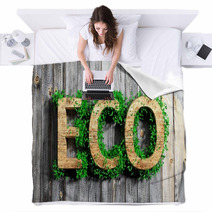 Wooden Eco Word With Vegetation Growth On Wooden Background Blankets 63609252