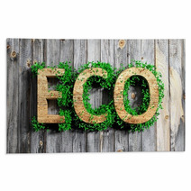 Wooden Eco Word With Vegetation Growth On Wooden Background Rugs 63609252