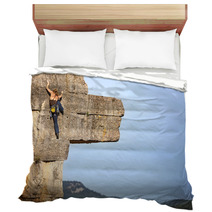 Young Female Free Climber On A Cliff Bedding 64083981