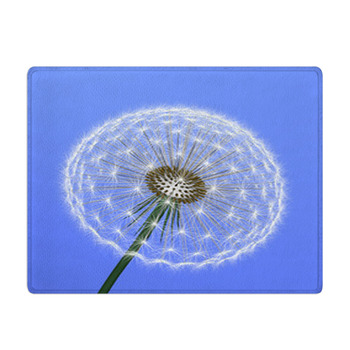 A Dandelion On Blue Background Bath Mat