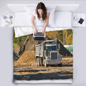 A Dump Truck About To Unload A Pile Of Fleece Blanket