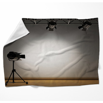 A Vintage Theater Spotlight On A Woven Throw Blanket