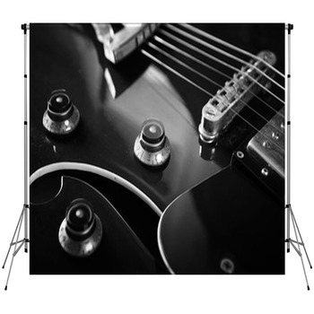 Acoustic Guitar Close Up In Dark Fleece Backdrop