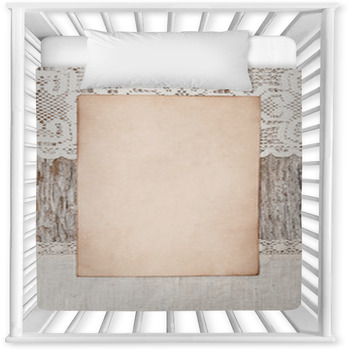 Aged Paper And Linen Fabric On The Baby Crib Comforter