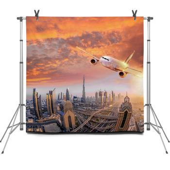 Airplane Is Flying Over Dubai Against Fleece Backdrop