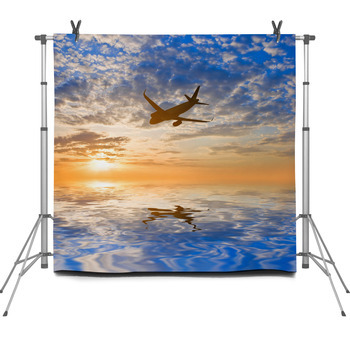 Airplane Silhouette Over A Sea At The Fleece Backdrop
